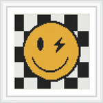 A winking happy face in yellow is placed on a black and white checkerboard background.
