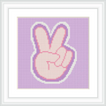 The image features a hand forming a peace sign, outlined and filled in a cross stitch pattern, on a lavender background.