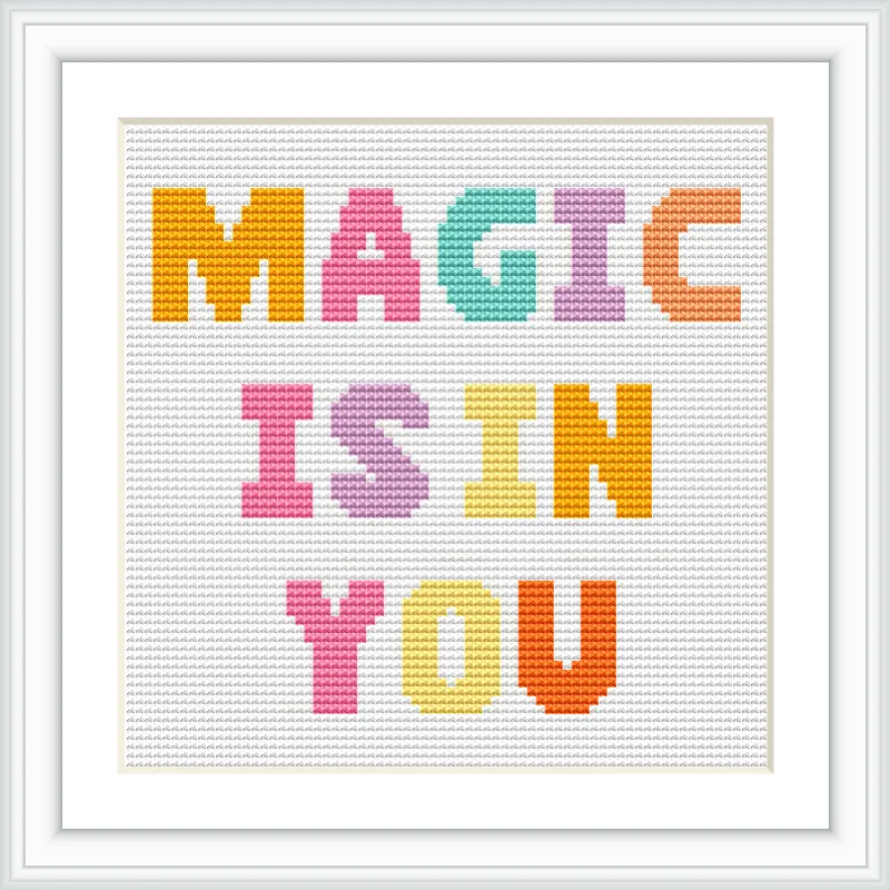 The image features a cross stitch pattern with the words 'MAGIC IS IN YOU' in large, colorful block letters framed with a white border. Each word is in a different color and centered on a white background.