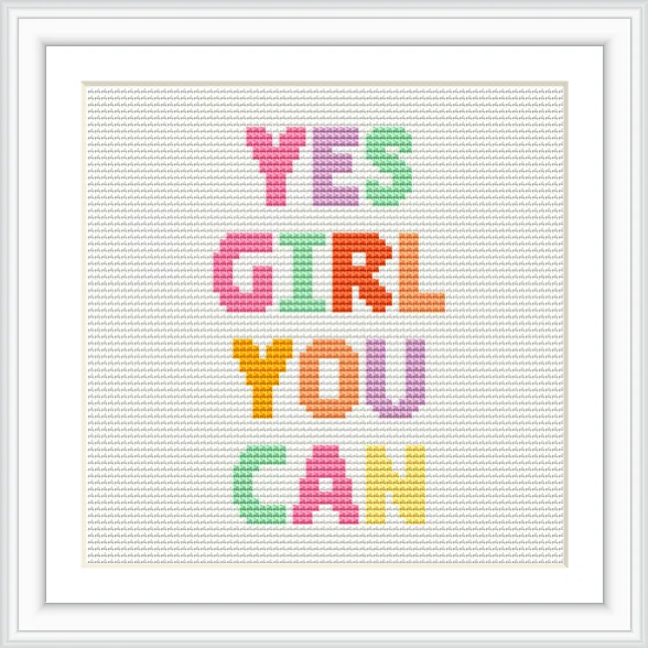 The image features a framed cross stitch pattern with the phrase 'Yes Girl You Can' in bold, colorful letters on a white background.