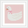 The image shows a white swan adorned with a pink ribbon around its neck, positioned against a soft pink background.