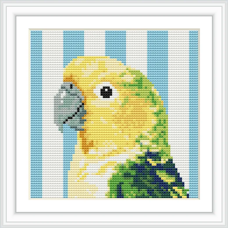 The image features a detailed cross stitch pattern of a yellow and green parakeet with a gray beak, set against a striped blue and white background.