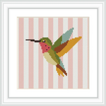 A colorful hummingbird in mid-flight set against a background of pink and white vertical stripes.
