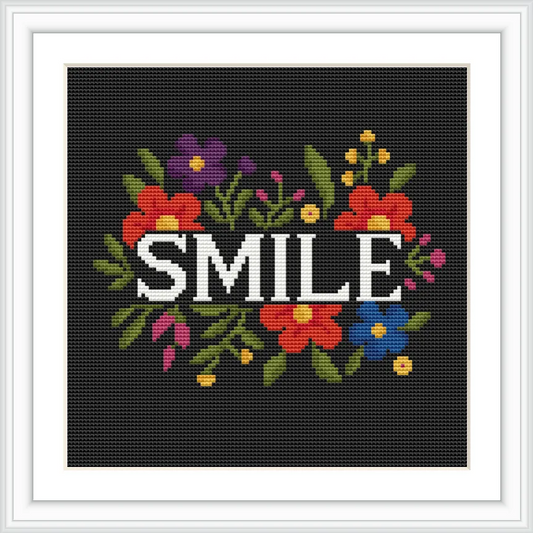A black background highlights colorful flowers surrounding the text 'SMILE' in white.