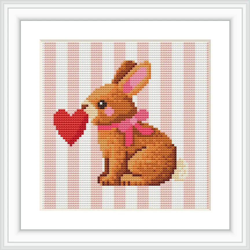 The image depicts a cute brown bunny sitting upright with a pink bow around its neck, holding a red heart in its mouth. The background features vertical pink and white stripes.