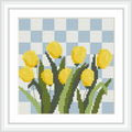 The image depicts vibrant yellow tulips with green leaves, arranged in a neat cluster. They are set against a blue and white checkered background, resembling a picnic blanket or a gingham pattern.