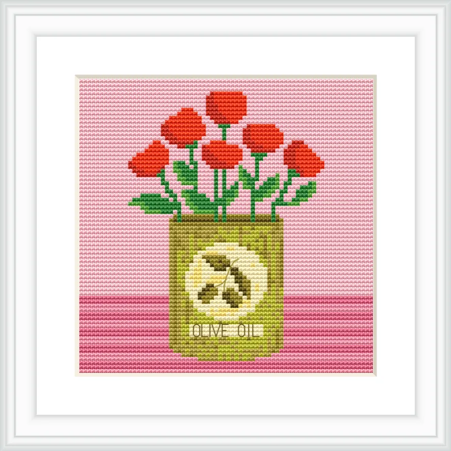 A can of olive oil is placed centrally, with red flowers sprouting from the top. The background is pink, and the can is decorated with an olive design.