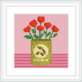 A can of olive oil is placed centrally, with red flowers sprouting from the top. The background is pink, and the can is decorated with an olive design.