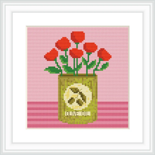 A can of olive oil is placed centrally, with red flowers sprouting from the top. The background is pink, and the can is decorated with an olive design.