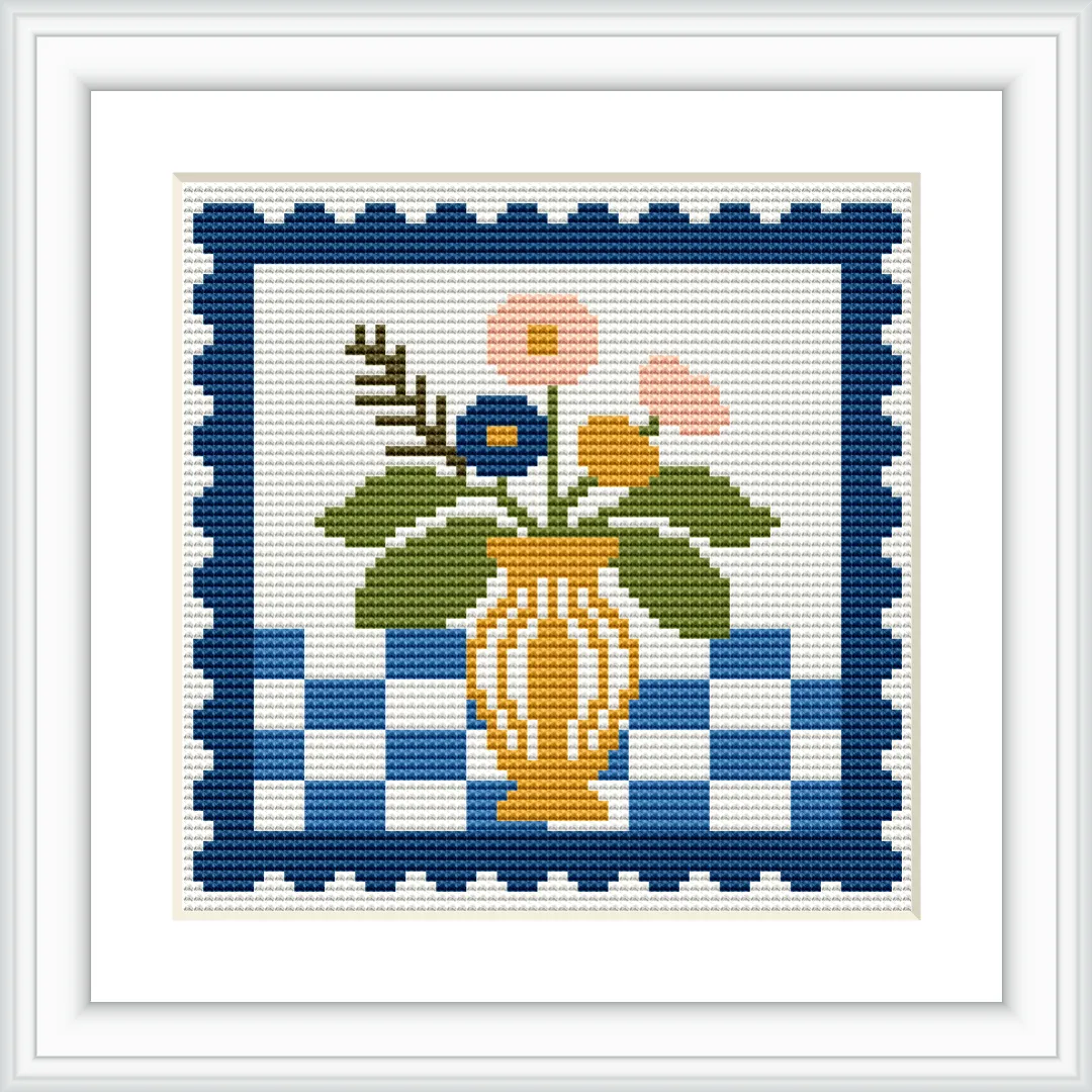 The image displays a cross stitch pattern of a vase containing flowers with a checkered design in the background, surrounded by a decorative border.