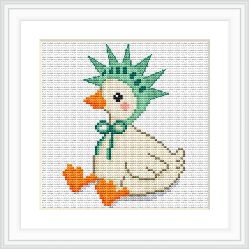 A goose with a cream-colored body is sitting upright, adorned with an orange beak and feet. It wears a green liberty hat with a matching bow under its neck. The background is plain white.