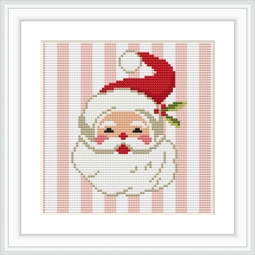 The image shows a cross-stitched Santa Claus head with a cheerful expression, wearing a red hat with a white puffball, set against a background of vertical pink and white stripes.