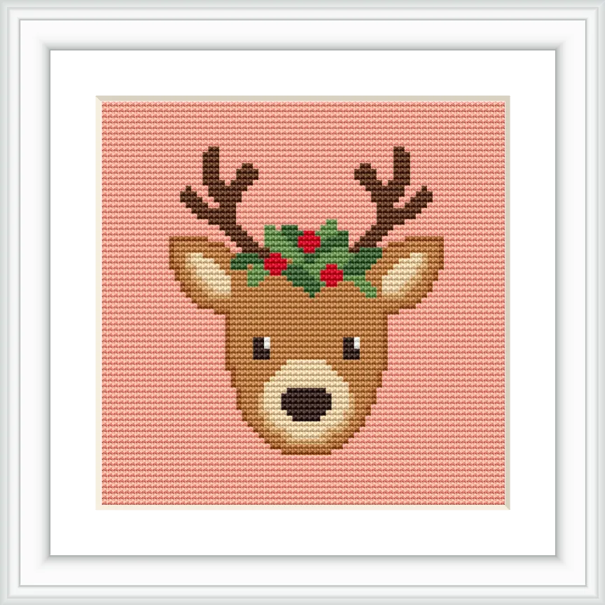 The image depicts a reindeer head on a peach background. The reindeer has antlers and is decorated with red berries and green leaves.