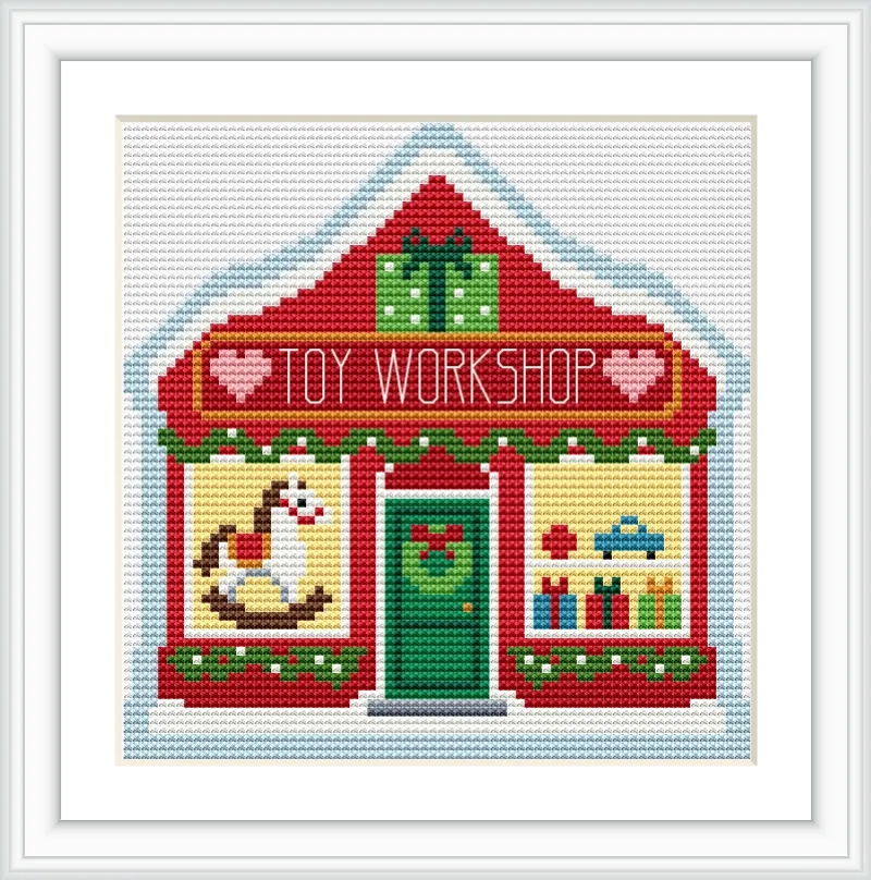 The image features a red and white toy workshop building with a snow-covered roof. The front displays Christmas decorations, toys, and gift boxes.