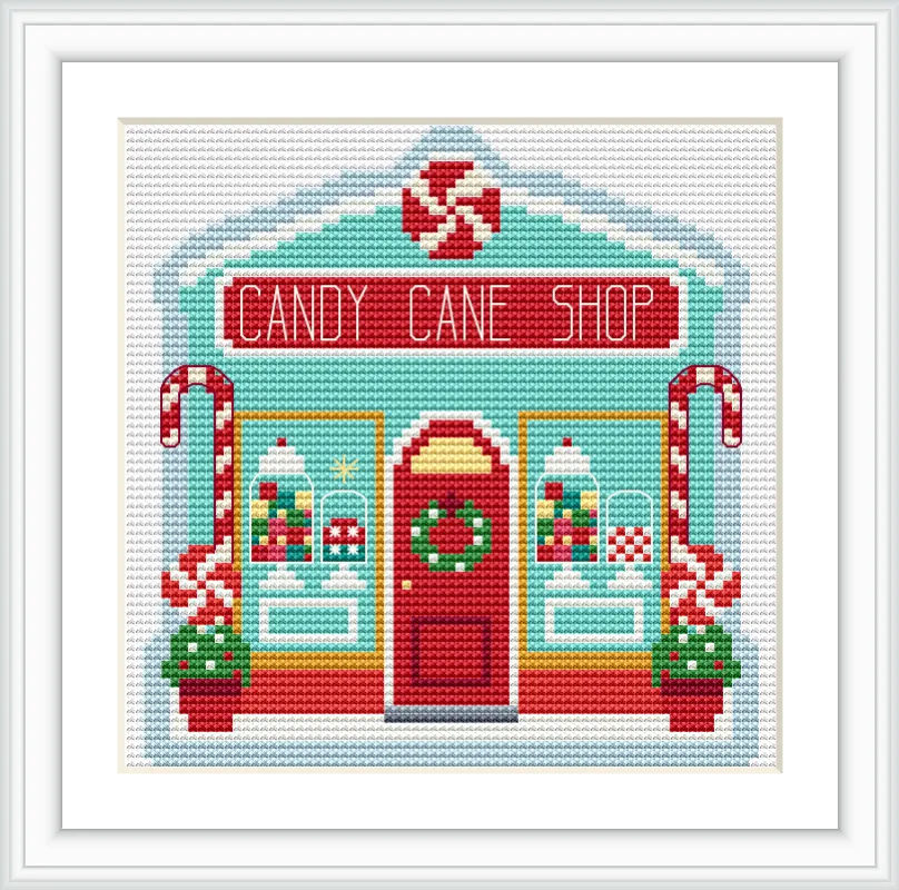 The image depicts a quaint shop front labeled 'Candy Cane Shop'. The building is adorned with candy canes and displays of sweets. It features a central red door with a wreath, flanked by colorful windows decorated with festive treats.