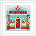 The image depicts a quaint shop front labeled 'Candy Cane Shop'. The building is adorned with candy canes and displays of sweets. It features a central red door with a wreath, flanked by colorful windows decorated with festive treats.