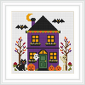 The image depicts a purple house with an orange roof, surrounded by fall trees. A black cat rests by two pumpkins on the left, while a ghost peeks from the window. A mummy stands on the right. Two bats fly overhead against a crescent moon backdrop.