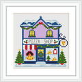 The image depicts a two-story purple pizza shop with a snow-covered roof, brightly lit windows, and festive decorations. Two Christmas trees stand outside with pizzas in the window displays under a sign reading 'Pizza Shop'.