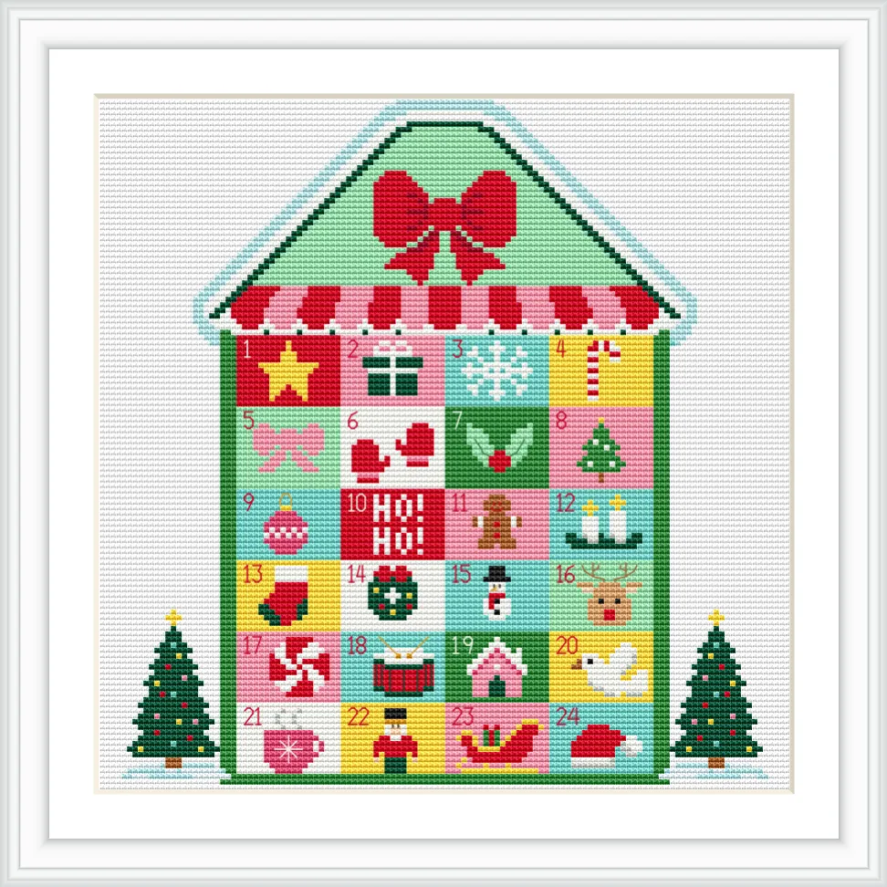 The image features a house-shaped Advent calendar with 24 numbered squares, decorated with Christmas motifs like gifts, stars, and stockings. Two decorated Christmas trees are at the base.