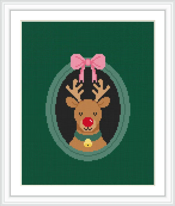A cartoon-style reindeer with a red nose is centered within a green oval frame. A pink bow sits above the reindeer.