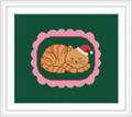 The image depicts a cute, orange-striped cat wearing a Santa hat, peacefully sleeping within a pink, scalloped oval frame against a green background.