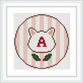 The design features a circle with a cat face outline in the center. The circle has a striped pattern in pink and white. Inside the cat's face, there's a red letter 'A'. Below, two green leaves with red berries are depicted.