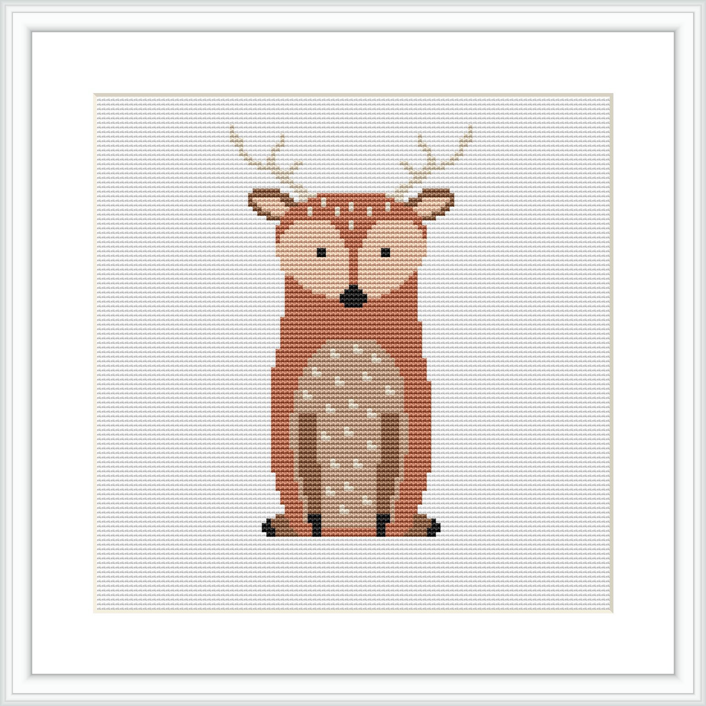 The image shows a cross stitch pattern of a stylized deer centrally placed on a white canvas within a square grid. The deer is depicted with a warm brown and beige color palette and features distinct white spots and black details for the eyes and hooves. The pattern is framed by a simple white border.
