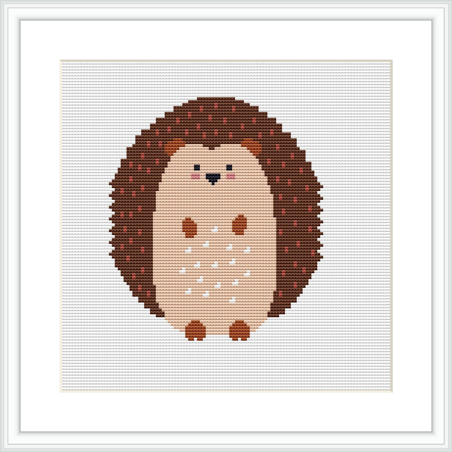 The image displays a framed cross stitch pattern of a hedgehog centrally positioned on a white background, featuring a brown and beige color palette.