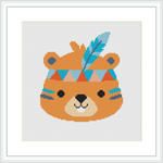 The image shows a framed cross stitch pattern of a cartoon-style beaver with tribal patterns and a feather on its head, centered on a white canvas background.