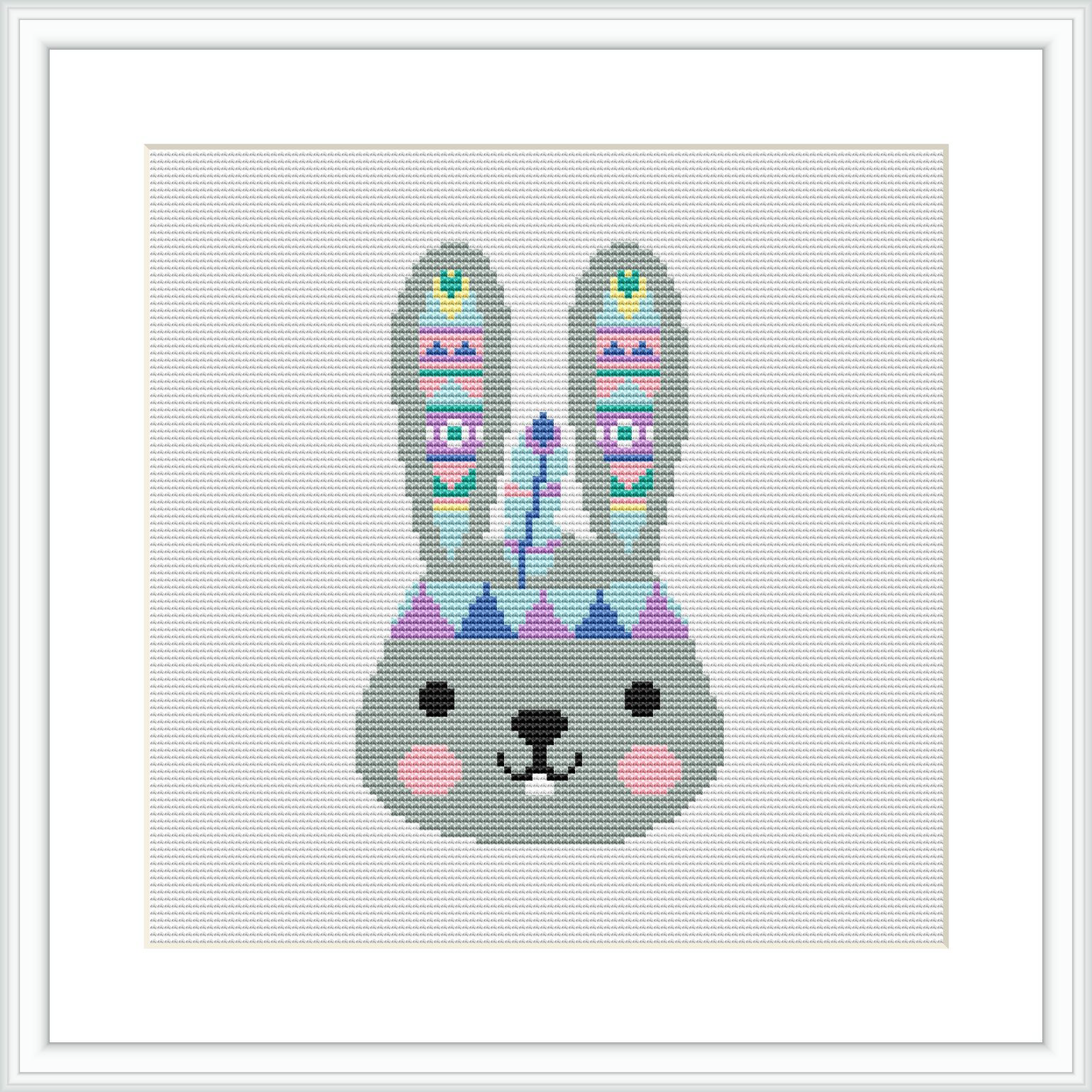 The image displays a framed cross stitch pattern of a stylized bunny with tribal patterns on its ears, and pastel-colored geometric shapes adorning its face, against a white background.