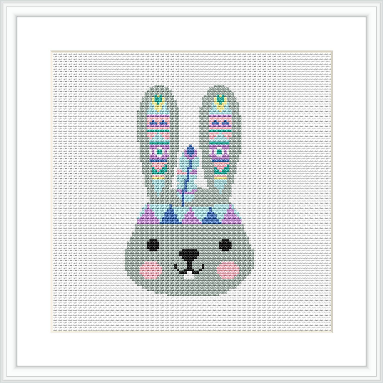 The image displays a framed cross stitch pattern of a stylized bunny with tribal patterns on its ears, and pastel-colored geometric shapes adorning its face, against a white background.