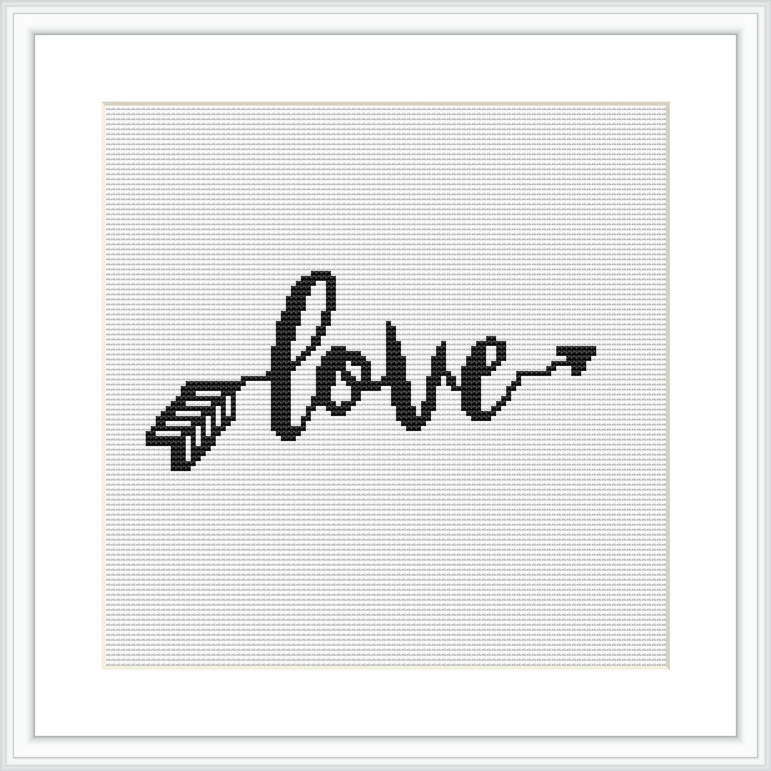 The image depicts a framed cross stitch pattern representing the word 'love' written in a cursive, calligraphic style with the last 'e' extending into an arrow. The pattern is monochrome, stitched with black thread on a white evenweave fabric.