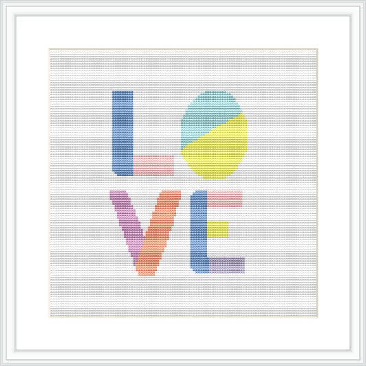 The image shows a framed cross stitch pattern featuring the word 'LOVE' with each letter in a different pastel color and style on a white canvas. The letters are arranged in a two-over-two grid within the square frame.