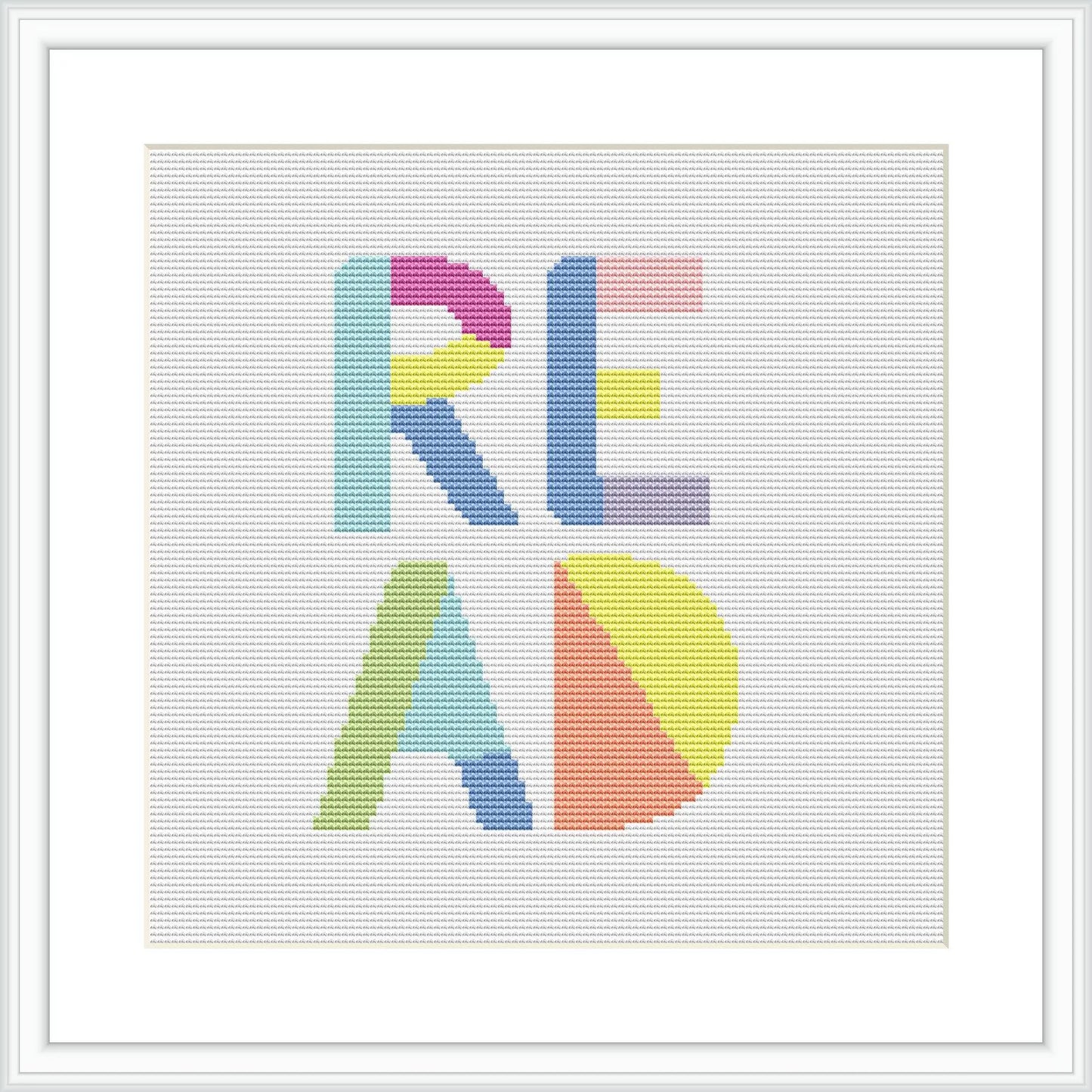 The image shows a cross stitch pattern of the word 'READ' in block letters, each letter rendered in a different pastel color. The design is framed and displayed on a simple white background.