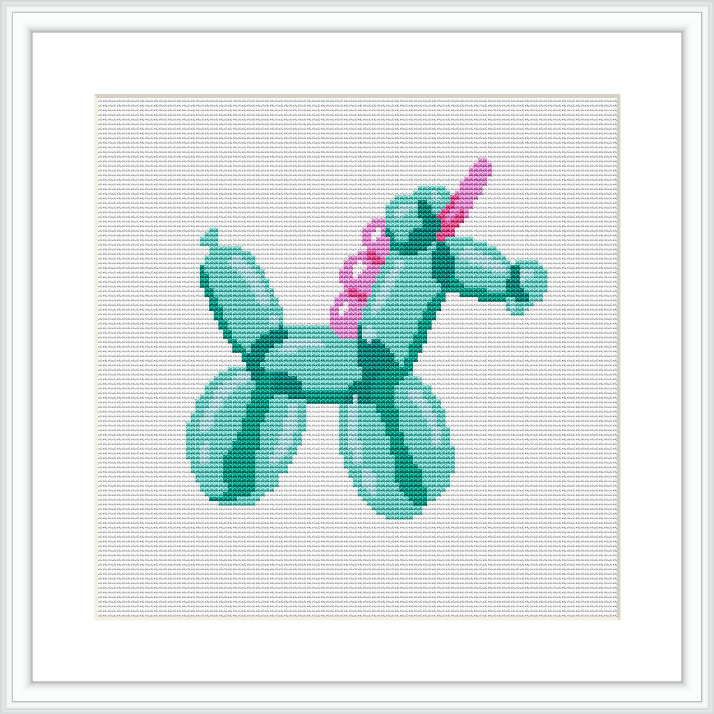 The image depicts a framed cross stitch pattern of a balloon shaped like a unicorn. It is embroidered in varying shades of turquoise and pink on a white canvas fabric that appears to be tightly stretched within a square frame.