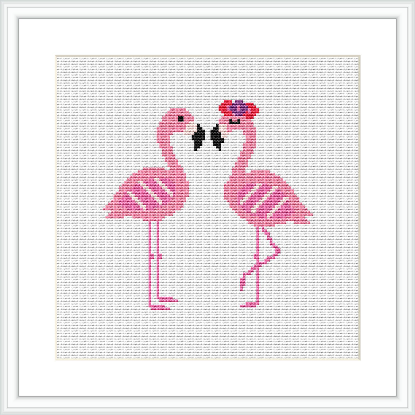 The image depicts a cross stitch pattern of two pink flamingos facing each other with their beaks touching, suggesting a kiss. They are positioned centrally on a white grid background, with a frame-like border around the pattern.