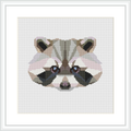 The image shows a framed cross stitch pattern of a stylized raccoon face with geometric shapes and a low poly design, predominantly in pastel pink and grey tones.