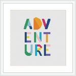 The image shows a cross stitch pattern with the word 'ADVENTURE' spelled out in bold, colorful block letters, centered on a white background within a square frame.