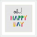 The image shows a framed cross stitch pattern featuring the phrase 'Oh Happy Day' with 'Oh' in cursive black font at the top and 'HAPPY DAY' in colorful block letters below. The pattern is displayed against a white background.