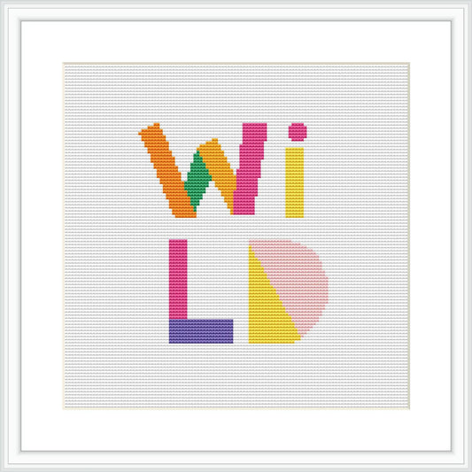 The cross stitch pattern features the word 'WiLD' with each letter designed in a different, bold color pattern, creating a patchwork of hues that stands against a plain white background.