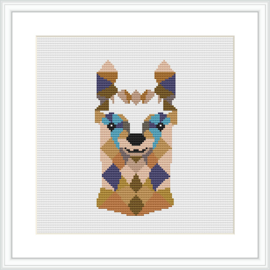 A framed cross stitch pattern of a stylized llama face predominantly in shades of teal, beige, purple, and brown, presented on a white background within a square frame.