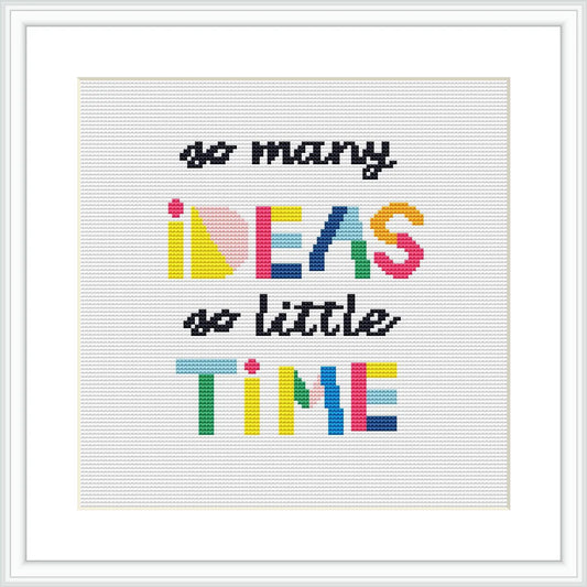 The image displays a cross stitch pattern featuring the phrase 'so many IDEAS so little TIME' in mixed fonts and colors with a white background, framed in a square frame.