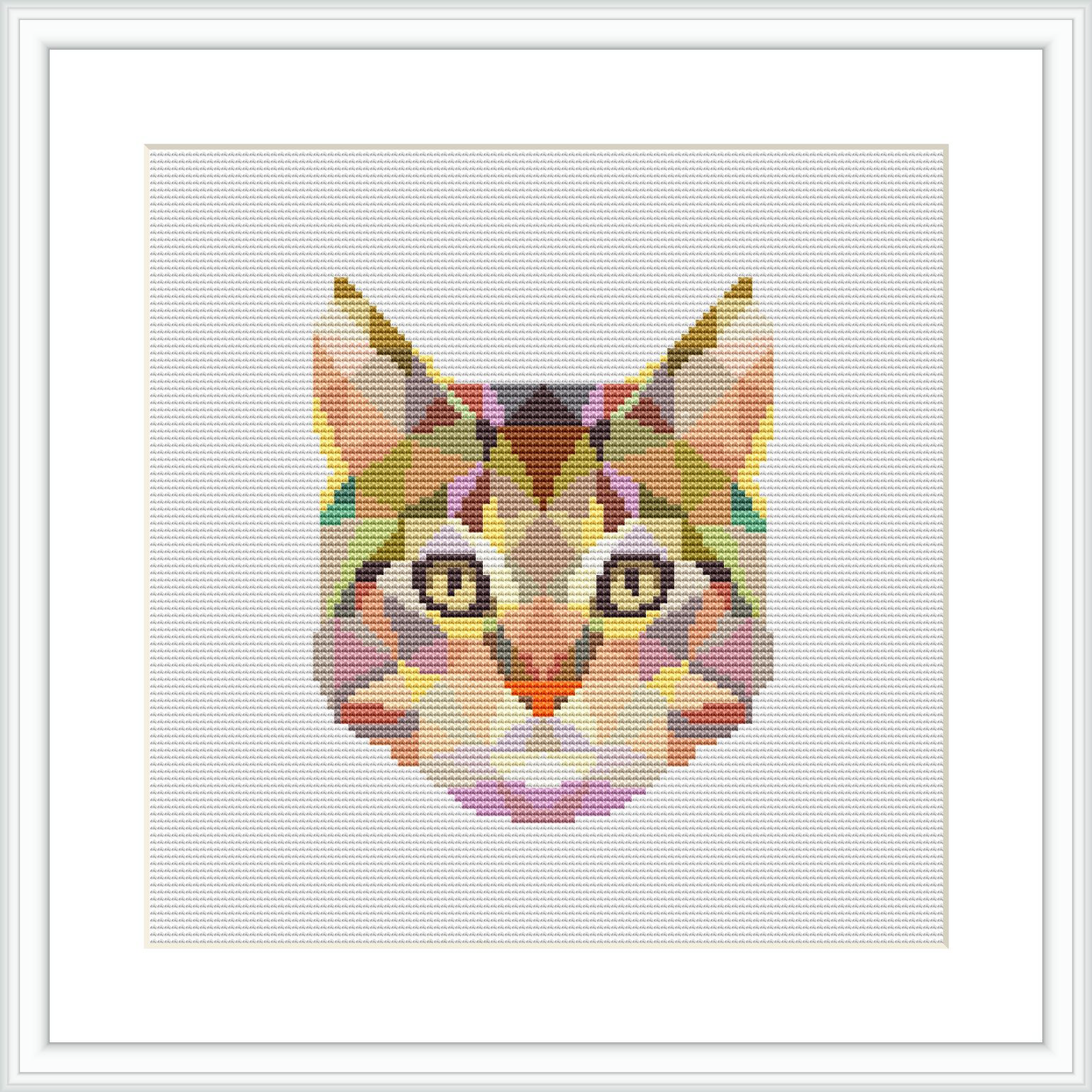 The image displays a framed cross stitch pattern of a cat's face, composed of various geometric shapes and colorful patterns, centered on a white canvas.