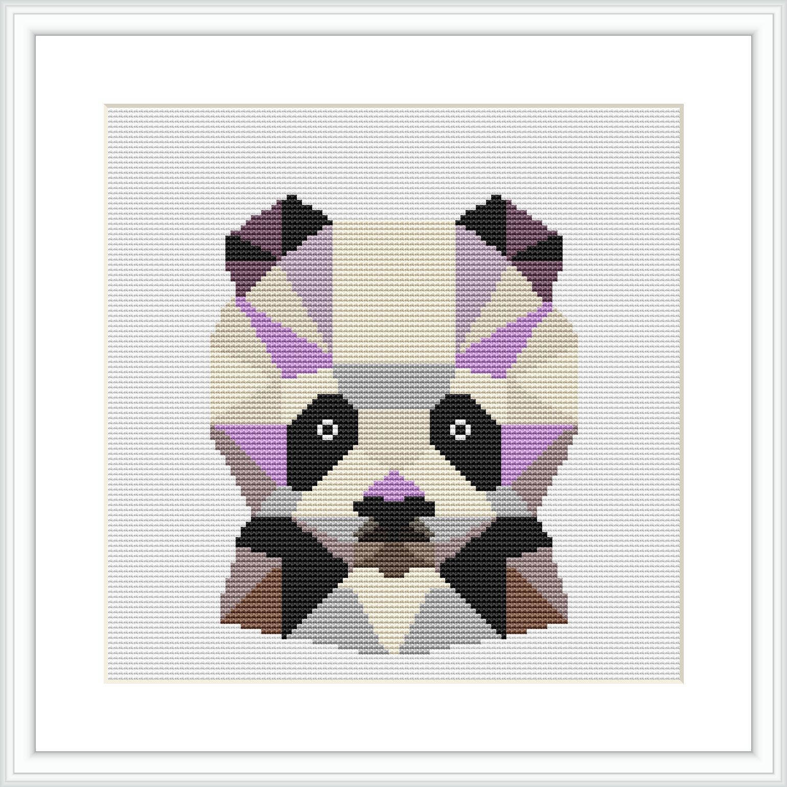 The image showcases a framed cross stitch pattern depicting a geometric representation of a panda's face. The pattern is square in shape, with a noticeable pixelated style, and uses a variety of colors, predominantly white, black, and shades of purple and brown.