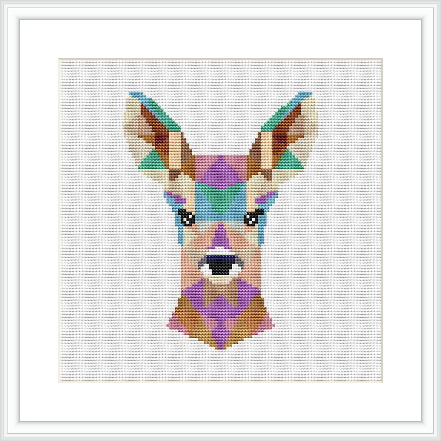 The image features a cross stitch pattern framed in white, depicting a stylized deer head composed of geometric shapes in various colors on a neutral background.