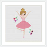 The image shows a cross stitch pattern of a smiling ballerina with arms and legs extended in a typical ballet pose. She wears a pink tutu, and there are small clusters of flowers in green and pink hues at the bottom left and right corners of the pattern.