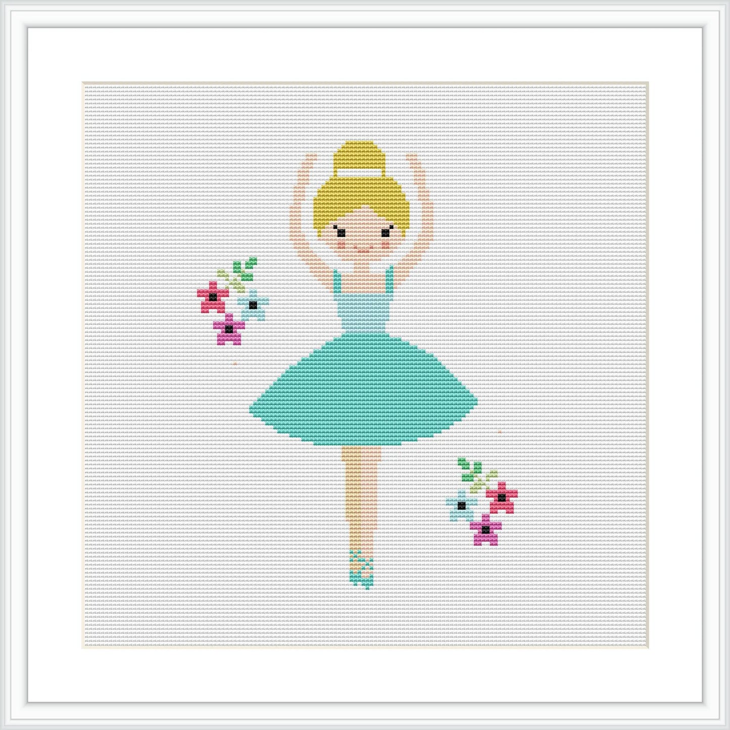 The image depicts a simplistic, stylized cross stitch design of a ballerina wearing a blue dress and a hat, standing en pointe with arms gracefully raised. The ballerina is centered on a white background with sparse, colorful floral motifs scattered around her.