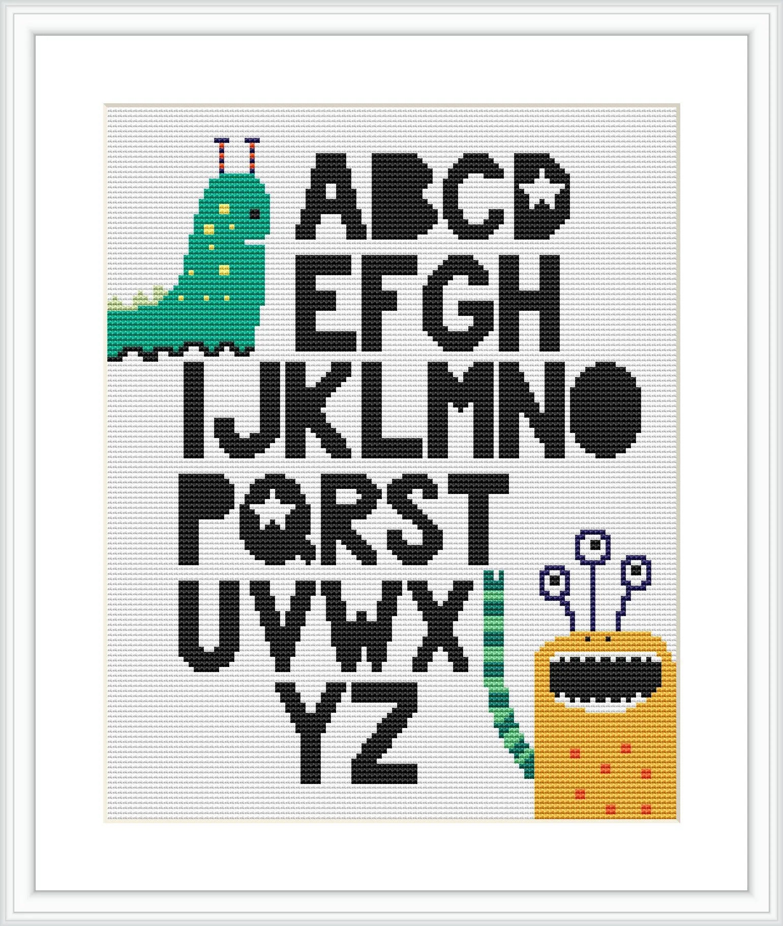 The image shows a white cross stitch canvas with black outlined and partially filled letters from A to Z. Two colorful, cartoon-style monsters are interacting with the letters. The design is presented in a simple black frame.