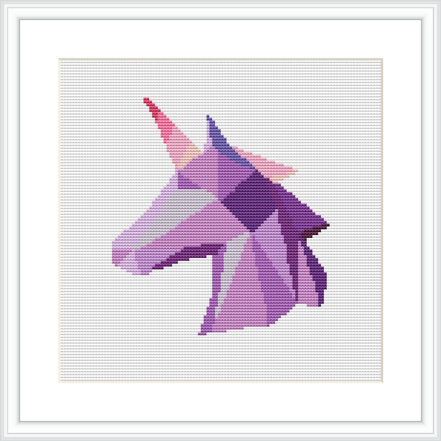 The image showcases a cross stitch pattern of a stylized unicorn head depicted in a geometric, faceted art style. It is framed in white and set against a white fabric background.