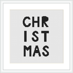 The image displays a framed cross stitch pattern with the word 'CHRISTMAS' spread out over three lines in a bold, sans-serif typeface. The letters are colored in black on a white canvas.